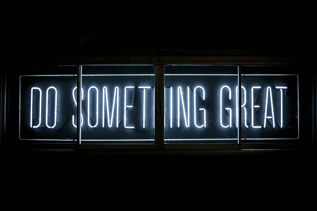 Do Something Great neon sign embodying the mission, vision, and values of naked sustainability 