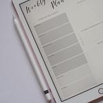 Digital Weekly Planner on iPad beside Apple Pencil