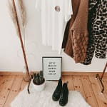 black combat shoes beneath a closet of date night fashion ideas