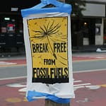 yellow sign indicating break free from fossil fuels