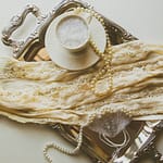 vintage secondhand clothing and accessories on a silver platter