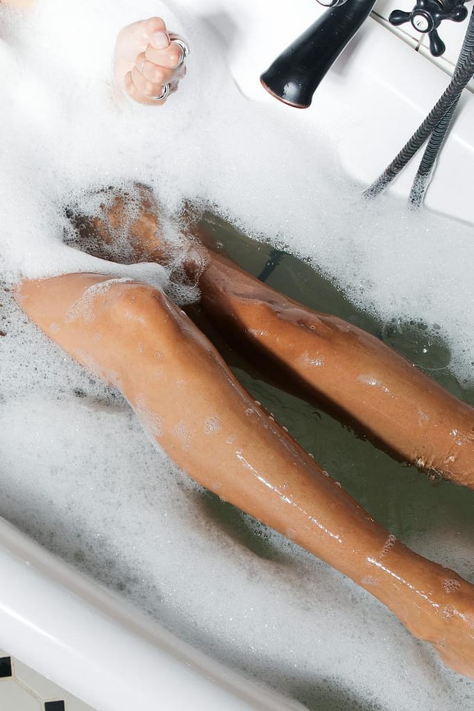 Legs of Woman Taking Bath before using zero waste shave cream