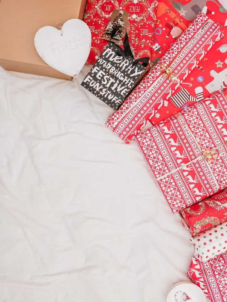 red and black packed presents on sustainable white textile